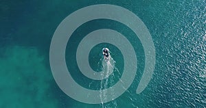 Aerial view fisherman on boat at the ocean. Top view aerial fishing on boat. Aerial view fishing motor boat with angler. Ocean sea