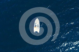 Aerial view fisherman on boat at the ocean. Top view beautiful seascape with the fishing boat. Aerial view fishing motor boat with