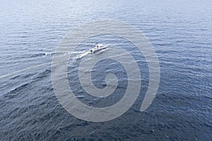 Aerial view fisherman on boat at the ocean. Top view beautiful seascape with the fishing boat. Aerial view fishing motor boat with