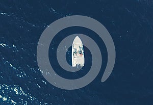 Aerial view fisherman on boat at the ocean. Top view beautiful seascape with the fishing boat. Aerial view fishing motor boat with