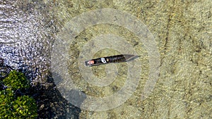 Aerial view of fishermen's boat in Mangroove in Palma District in Cabo Delgado, Mozambique photo