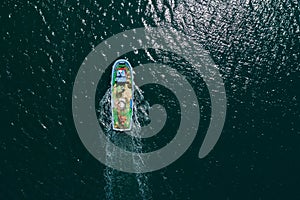 Aerial view of fishing boat floating in the sea