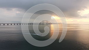 Aerial view fishing boat move at sea near Penang Second Bridge