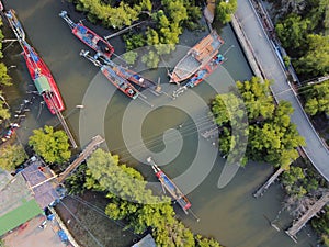 Aerial view of Fishing boat in the traditional fishing village, Mangrove tree and road