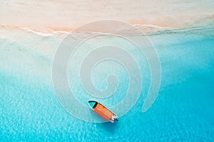 Aerial view of the fishing boats in clear blue water