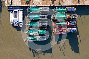Aerial view of fishing boats moored at marina