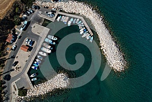 Aerial view of fishing boats and tourist yachts moored at the marina. Pomos harbor Paphos Cyprus