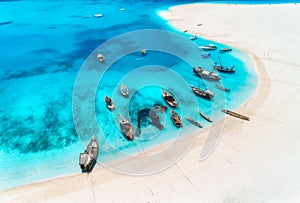 Aerial view of the fishing boats and yachts on tropical sea coast