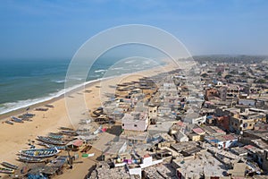 Aerial view of fishing village, pirogues fishing boats in Kayar, Senegal.  Photo made by drone from above. Africa Landscapes