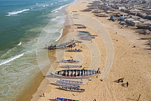 Aerial view of fishing village, pirogues fishing boats in Kayar, Senegal.  Photo made by drone from above. Africa Landscapes