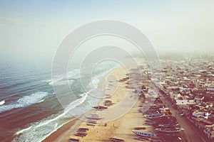 Aerial view of fishing village, pirogues fishing boats in Kayar, Senegal.  Photo made by drone from above. Africa Landscapes