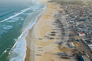 Aerial view of fishing village, pirogues fishing boats in Kayar, Senegal.  Photo made by drone from above. Africa Landscapes