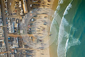 Aerial view of fishing village, pirogues fishing boats in Kayar, Senegal.  Photo made by drone from above. Africa Landscapes