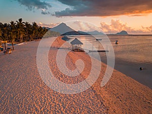 Aerial view of Flic and Flac, Mauritius in sunset light. Exotic beach sunset