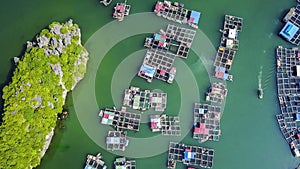 Aerial view of floating fishing village and rock island in Cat Ba island from above. Lan Ha bay. Hai phong, Vietnam
