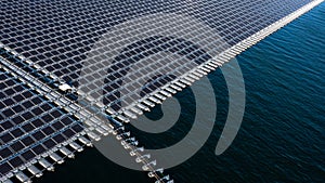 Aerial view floating solar cell power plant with solar cell generate the electric on the lake, Floating solar panels and cell