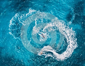 Aerial view of floating water scooter in blue water at sunny day