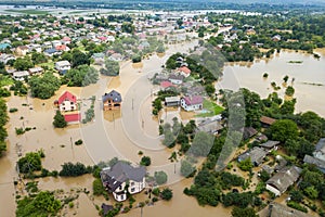 Aerial view of flooded houses with dirty water of Dnister river in Halych town, western Ukraine photo