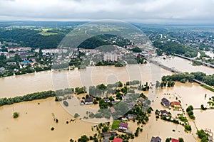 Aerial view of flooded houses with dirty water of Dnister river in Halych town, western Ukraine photo