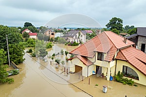 Aerial view of flooded houses with dirty water of Dnister river in Halych town, western Ukraine photo