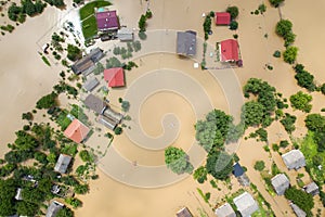 Aerial view of flooded houses with dirty water of Dnister river in Halych town, western Ukraine photo