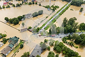 Aerial view of flooded houses and rescue vehicles saving people in Halych town, western Ukraine
