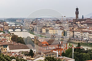 Aerial view of Florence, Italy. Ponte Vecchio (Old Bridge) over the Arno River and the Palazzo Vecchio, town hal