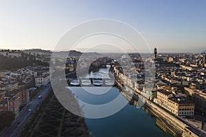 Aerial view of Florence skyline along Arno river with Ponte Vecchio and Santa Maria del Fiore church, Tuscany, Italy