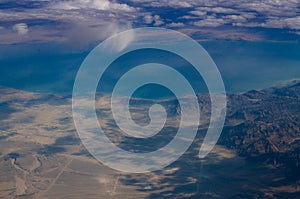 Aerial view fluffy clouds above desert landscape and Suez Gulf in Egypt