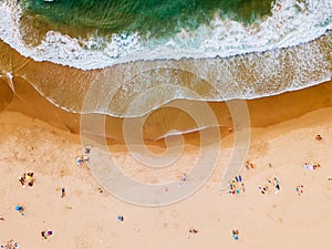 Aerial View From Flying Drone Of People Crowd Relaxing On Algarve Beach