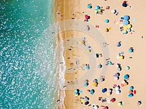 Aerial View From Flying Drone Of People Crowd Relaxing On Beach photo