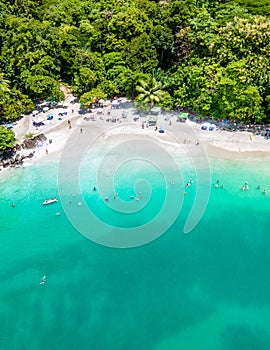 Aerial View From Flying Drone Of People Crowd Relaxing On Beach In Costa Rica