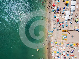 Aerial View From Flying Drone Of People Crowd Relaxing On Beach In Romania