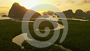 Aerial view flying forward to the sea,sunrise over mountain, Phang nga, Thailand