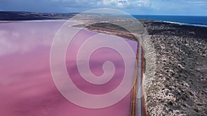 aerial view, flying forward to the south, of the pink water of hutt lagoon