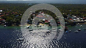 Aerial view flying over amazing of sandy beach clear sea water of the Sumilon island beach landing near Oslob, Cebu, Philippines.