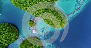 Aerial view flying over the beautiful and tropical green mountains Sugba Lagoon in Siargao, Philippines