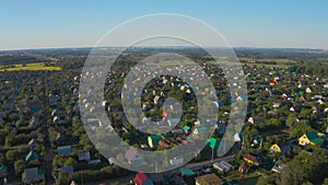 Aerial view, flying over the country cottage village in summer, Russia summer houses, drone shot.