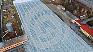 Aerial View Flying Over Large Greenhouse With Vegetables