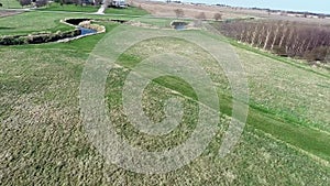 Aerial view flyover agriculture fields and farmland in Illinois corn belt - Midwest America