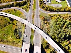 Aerial view of the flyover and interchanges on a sunny day. Modern building design of the roadway to avoid traffic jams. Few cars