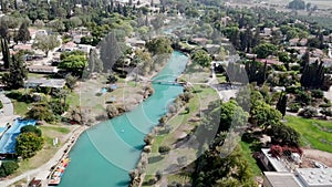 Aerial view flyover kibbutz Nir David, North of Israel. A view of farmland close to Beit shean valley with river channel