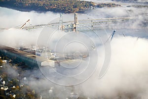Aerial view of fog over Bath Iron Works and Kennebec River in Maine. Bath Iron Works is a leader in surface combatant design and photo