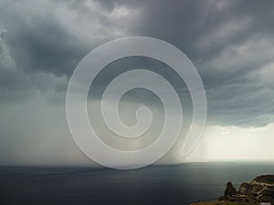 Aerial view footage of rain clouds over sea ocean Black clouds in bad weather day over sea surface High angle view