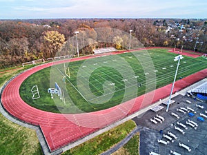 Aerial View of Football Field with Running Track Around the Perimeter