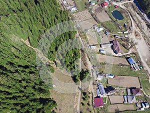 Aerial view of forest and village in countryside of Petru Voda