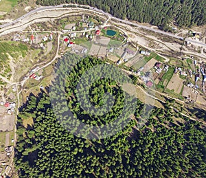 Aerial view of forest and village in countryside of Petru Voda