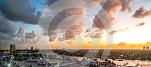 Aerial view of Fort Lauderdale waterway canals, residential homes and skyline at sunset