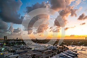 Aerial view of Fort Lauderdale waterway canals, residential homes and skyline at sunset