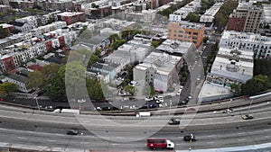 Aerial view of a freeway cutting through Brooklyn